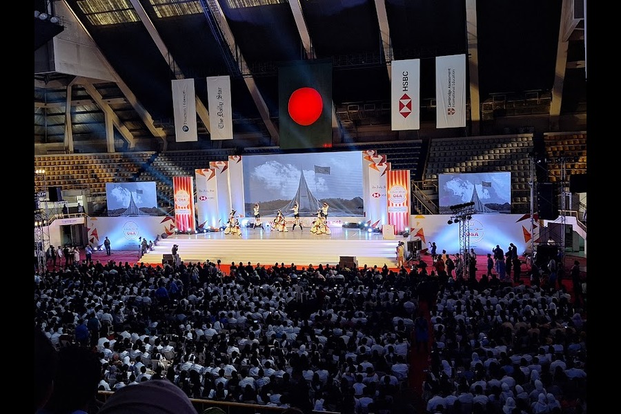Large event stage and audience at a corporate brand program